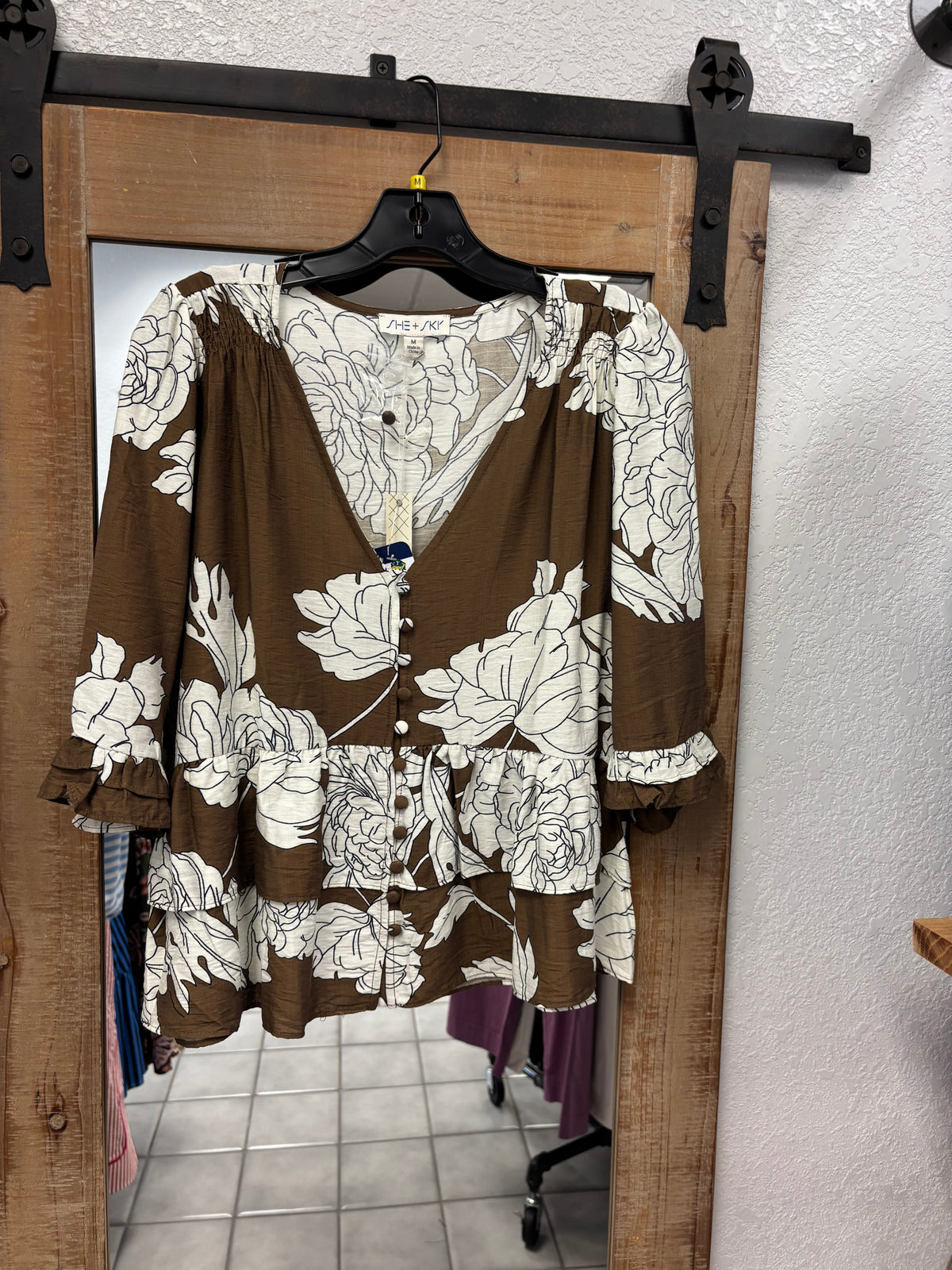 She and Sky- Brown top with white flowers